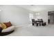 The dining room features a modern chandelier and comfortable seating, perfect for entertaining at 20102 Oakflower Ave, Tampa, FL 33647