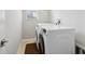 A laundry room featuring a washer, dryer, neutral walls, and a window for natural light at 20102 Oakflower Ave, Tampa, FL 33647