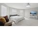 Generously sized bedroom with large windows providing ample natural light and a comfortable ambiance at 20102 Oakflower Ave, Tampa, FL 33647