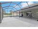 Extensive covered patio with lounge areas and basketball hoop, ideal for outdoor entertainment at 20102 Oakflower Ave, Tampa, FL 33647