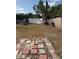 Fenced-in backyard, with pool in the distance, featuring brick pavers at 2026 Aaron Pl, Clearwater, FL 33760