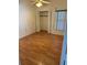 A cozy bedroom features laminate floors, a closet, and a window for natural lighting at 2026 Aaron Pl, Clearwater, FL 33760