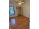 Small, basic bedroom with laminate flooring, closet, and window for natural light at 2026 Aaron Pl, Clearwater, FL 33760