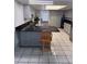 Modern kitchen with granite countertops, stainless steel appliances, and tile flooring at 2026 Aaron Pl, Clearwater, FL 33760