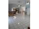 Expansive layout with tile flooring connecting the living, dining, and kitchen spaces at 2026 Aaron Pl, Clearwater, FL 33760