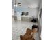 A bright, spacious living room with tiled flooring and neutral tones, ready for personal touches at 2026 Aaron Pl, Clearwater, FL 33760