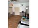 Open living space featuring hard wood floors, a ceiling fan, and abundant natural light at 2026 Aaron Pl, Clearwater, FL 33760
