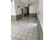 Bright living room featuring tile floors, a ceiling fan, and large windows at 2026 Aaron Pl, Clearwater, FL 33760