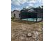 Home's backyard featuring a screened in pool with a patio area at 2026 Aaron Pl, Clearwater, FL 33760