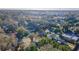 An aerial view shows a neighborhood with lush greenery and mature trees, creating a peaceful and inviting residential setting at 2035 29Th N Ave, St Petersburg, FL 33713