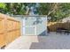 Backyard shed is perfect for extra storage, with a grilling area and patio set nearby at 2035 29Th N Ave, St Petersburg, FL 33713