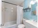 Cozy bathroom featuring a shower with blue-striped curtain and blue wall at 2035 29Th N Ave, St Petersburg, FL 33713
