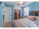 Well-lit bedroom with closet space, ceiling fan and tile floor at 2035 29Th N Ave, St Petersburg, FL 33713