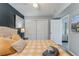 Bedroom with queen bed, closet, ceiling fan, and view into kitchen, plenty of storage at 2035 29Th N Ave, St Petersburg, FL 33713