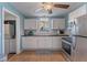 Well-equipped kitchen featuring white cabinetry, modern appliances, and a functional layout for cooking and preparing meals at 2035 29Th N Ave, St Petersburg, FL 33713