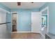 Additional kitchen photo showing stainless fridge, access to a pantry, and doorway to another room at 2035 29Th N Ave, St Petersburg, FL 33713