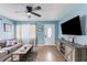 Relaxing living room featuring tile floors, a modern TV setup, and large windows offering ample natural light at 2035 29Th N Ave, St Petersburg, FL 33713