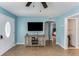 Inviting living room with modern entertainment setup, tile flooring, and open layout, creating a cozy atmosphere at 2035 29Th N Ave, St Petersburg, FL 33713