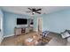 Bright living room with a TV, comfortable sofa, and tile flooring, perfect for relaxing and entertaining guests at 2035 29Th N Ave, St Petersburg, FL 33713
