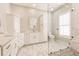 Modern bathroom features marble floors, a walk-in shower, and vanity at 2100 Aqui Esta Dr, Punta Gorda, FL 33950