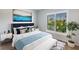 Cozy bedroom with natural light and a queen-sized bed at 2100 Aqui Esta Dr, Punta Gorda, FL 33950
