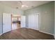 Bedroom with wood floor and double doors to an adjoining room at 2100 Aqui Esta Dr, Punta Gorda, FL 33950