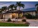 Beautiful shot of the front elevation and landscaping of this single Gathering home at 2100 Aqui Esta Dr, Punta Gorda, FL 33950