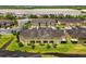 Aerial view showcasing the back of the townhouses and green spaces in a well-kept neighborhood at 2129 Lennox Dale Ln, Brandon, FL 33510