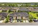 A scenic aerial view showcasing the townhouse complex with well-maintained landscaping at 2129 Lennox Dale Ln, Brandon, FL 33510