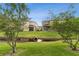 Beautiful backyard view with a small creek flowing between two homes at 2129 Lennox Dale Ln, Brandon, FL 33510