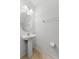 Bathroom featuring pedestal sink, mirror, and tiled floor at 2129 Lennox Dale Ln, Brandon, FL 33510