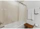 Bathroom featuring a shower, white tile, towels, and wooden stool at 2129 Lennox Dale Ln, Brandon, FL 33510