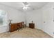 Bedroom featuring a desk, ceiling fan, window, and carpeting at 2129 Lennox Dale Ln, Brandon, FL 33510