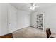Bedroom with carpet, closet, ceiling fan and a bookshelf at 2129 Lennox Dale Ln, Brandon, FL 33510