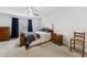 Comfortable bedroom featuring a ceiling fan, neutral carpet, and wooden furniture at 2129 Lennox Dale Ln, Brandon, FL 33510