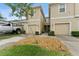 Inviting townhome featuring a one car garage, neutral paint and well maintained landscaping at 2129 Lennox Dale Ln, Brandon, FL 33510