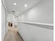 Bright hallway with neutral carpet and white paint, offering a clean and airy feel at 2129 Lennox Dale Ln, Brandon, FL 33510