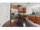 Well-equipped kitchen with stainless steel appliances, granite countertops, and wooden cabinetry at 2129 Lennox Dale Ln, Brandon, FL 33510