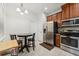 Bright kitchen featuring modern stainless steel appliances and wooden cabinetry at 2129 Lennox Dale Ln, Brandon, FL 33510