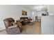 Inviting living room with hardwood floors, a ceiling fan and comfortable leather furniture at 2129 Lennox Dale Ln, Brandon, FL 33510