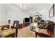 Comfortable living room with hardwood floors, a ceiling fan and a sliding glass door to the outside at 2129 Lennox Dale Ln, Brandon, FL 33510