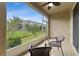 Screened patio with two chairs and views of the lawn at 2129 Lennox Dale Ln, Brandon, FL 33510