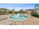 Community pool surrounded by lounge chairs and tables for residents to relax at 2129 Lennox Dale Ln, Brandon, FL 33510