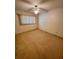 Cozy bedroom with neutral carpet and ample natural light at 2360 Irish Ln # 16, Clearwater, FL 33763