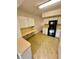 Bright kitchen with ample counter space, white cabinets, and modern appliances for meal preparation at 2360 Irish Ln # 16, Clearwater, FL 33763
