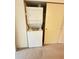 In-unit laundry with stacked washer and dryer at 2360 Irish Ln # 16, Clearwater, FL 33763