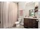 Bathroom featuring a vanity, toilet, shower, and modern finishes at 2604 E Chelsea St, Tampa, FL 33610
