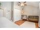 Another view of bright bedroom with wave-themed wall and ceiling fan at 2604 E Chelsea St, Tampa, FL 33610