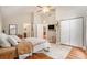 Cozy bedroom featuring neutral walls, ceiling fan, and natural light at 2604 E Chelsea St, Tampa, FL 33610