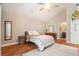 Neutral bedroom with ceiling fan, ensuite bathroom, and ample sunlight at 2604 E Chelsea St, Tampa, FL 33610